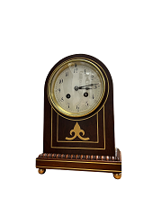 Round top mahogany striking mantle clock